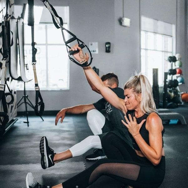 Unsplash Personal trainer coaching a client